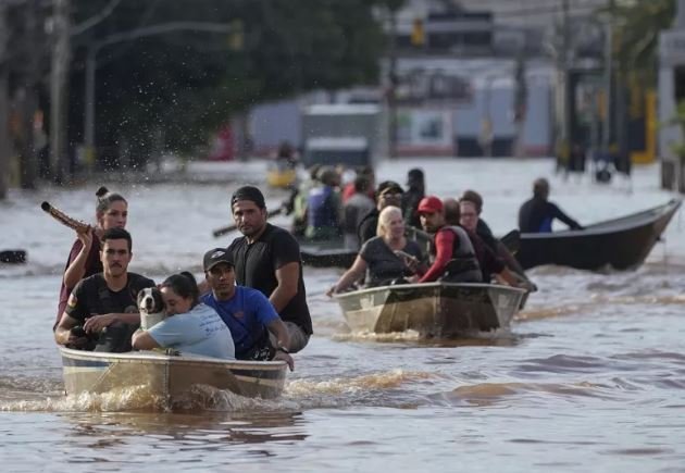 In Brazil, severe flooding results in thousands of homeless people and at least 100 dead.