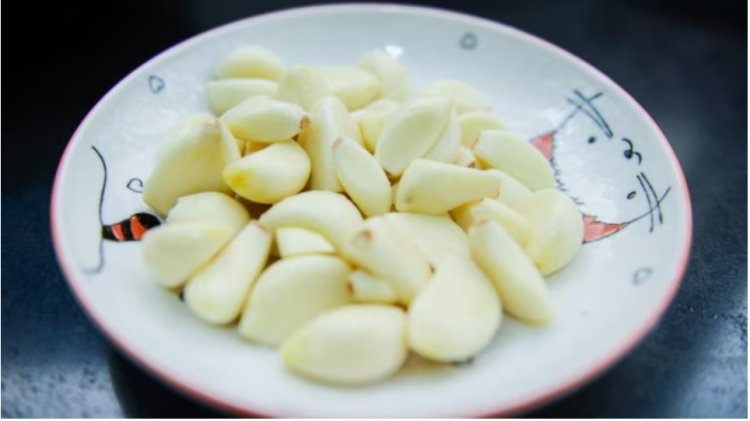 Can eating two bulbs of garlic a day lower cholesterol and blood sugar?